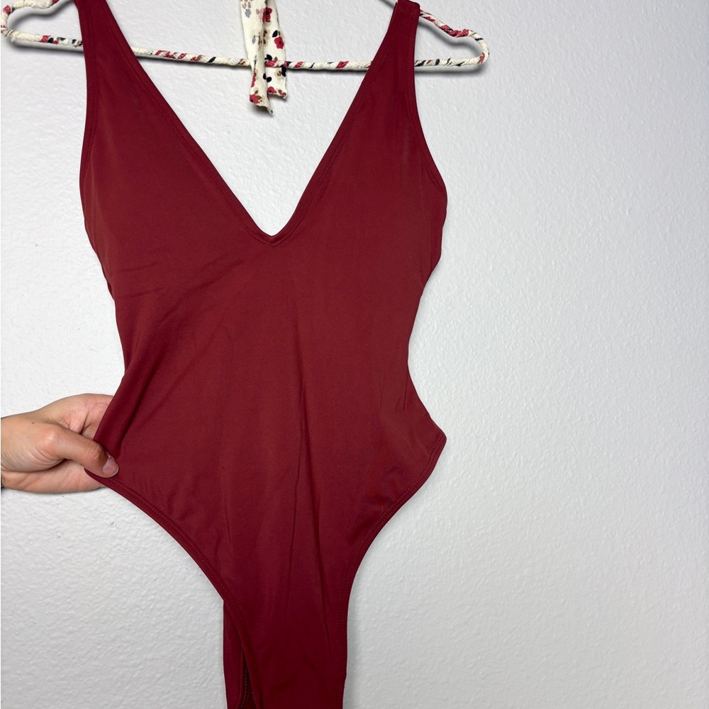 Burgundy red rust sculpt and shape plungey one piece swimsuit